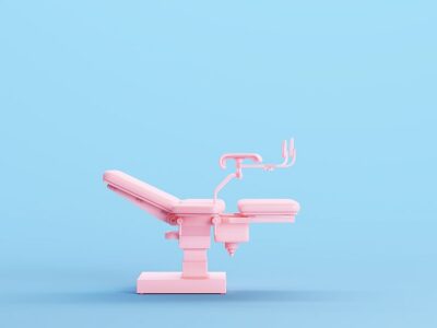 Pink Gynaecology Obstetrics Chair Female Health Care Reproductive Systems Specialist Women's Health Clinic Kitsch Blue Background Side View 3d illustration render digital rendering